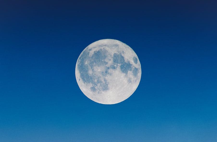 full moon on a blue sky